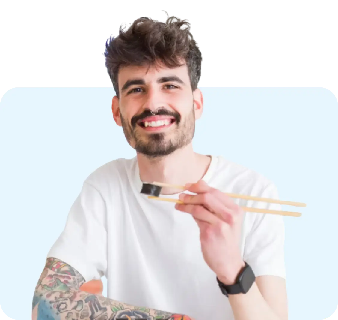 man eating something with chop-sticks